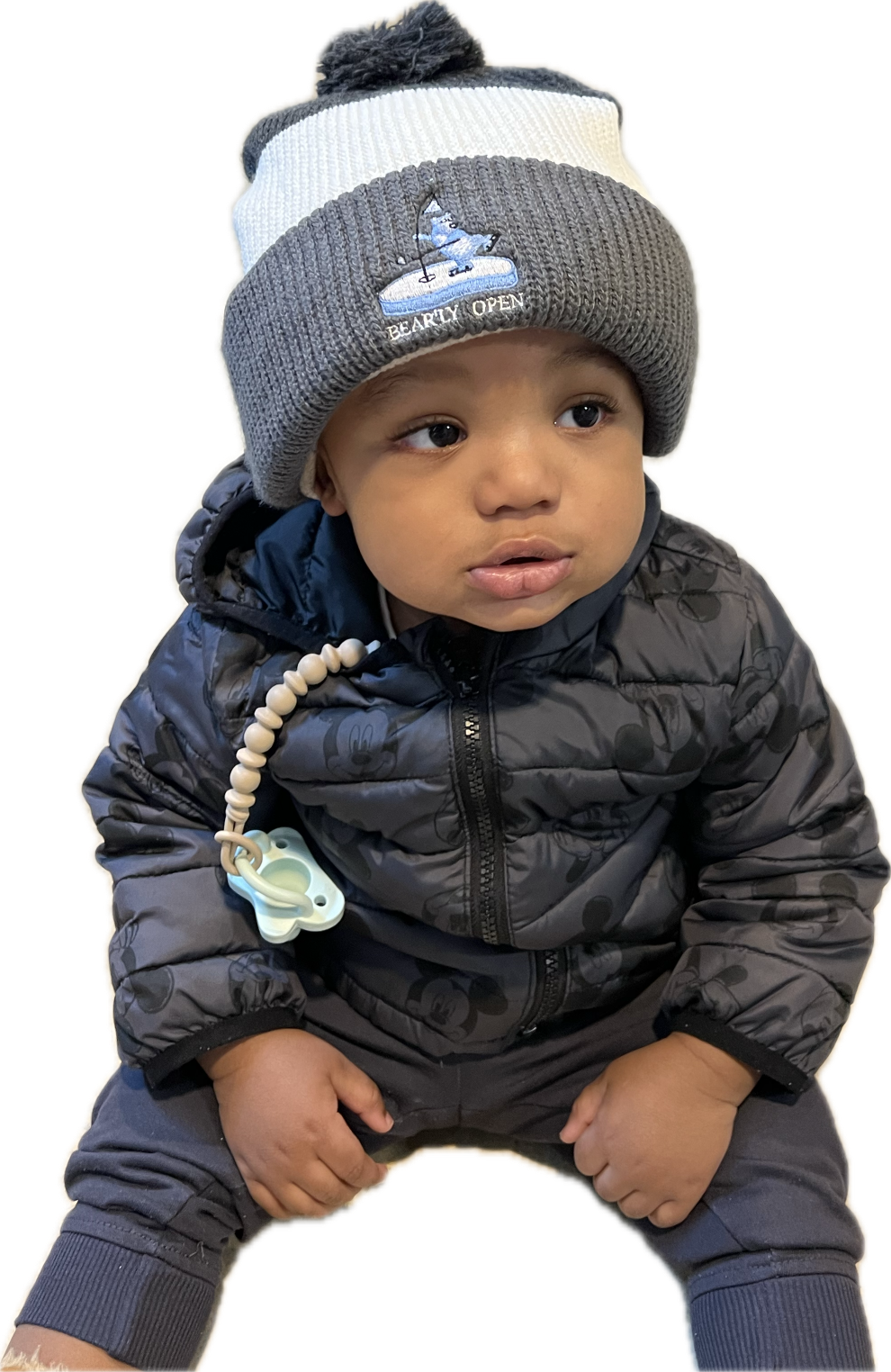 Young boy wearing hat.